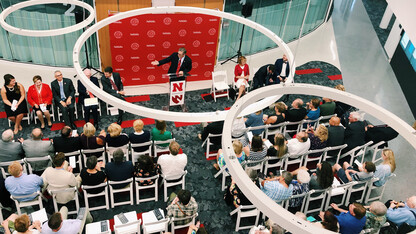 Chancellor Ronnie Green (at podium) gestures during the July 10 open house at the new University Health Center facility. The 107,000-square-foot facility is the new home to the University Health Center and the Lincoln division of the University of Nebraska Medical Center's nursing program.