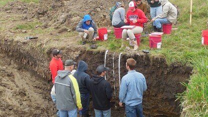 Members of the UNL Soil Judging Team analyze soils in a practice pit at the Region 5 contest in Ames, Iowa. (Photo courtesy Becky Young)