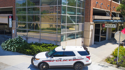 A university police vehicle sits in front of the UNLPD station.