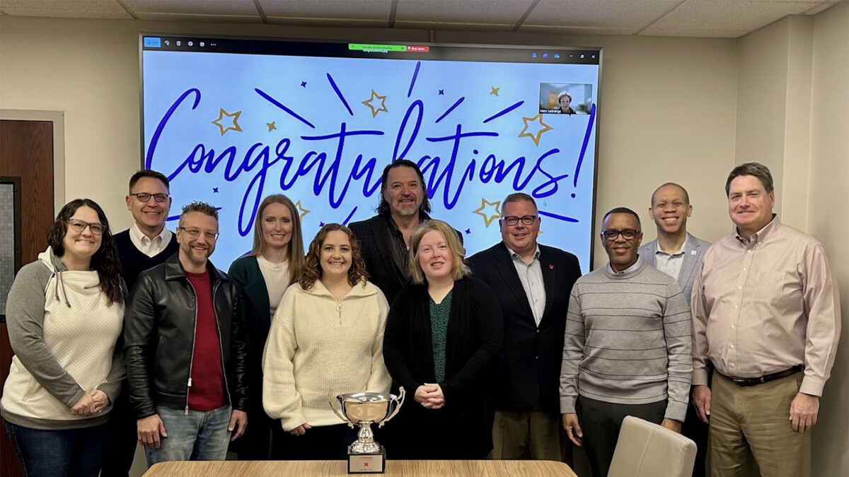 Members of the Business and Finance team pose with Lawrence Chatters and the Chancellor's Cup after earning the Large Office Division in the 2024-25 United Way campaign.