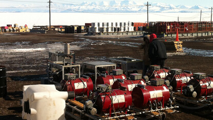 ANDRILL's roving hot water drill is on the ground in Antarctica at McMurdo Station on Ross Island. McMurdo Sound and the Transarctic Mountains on the Antarctic mainland are in the background.