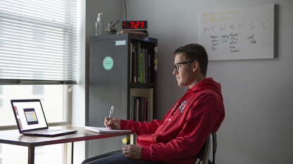 James Wooldridge, a senior journalism major, studies in his Lincoln apartment during the spring 2020 semester. After a shift in the fall academic calendar, the university is offering a three-week session starting Nov. 30.