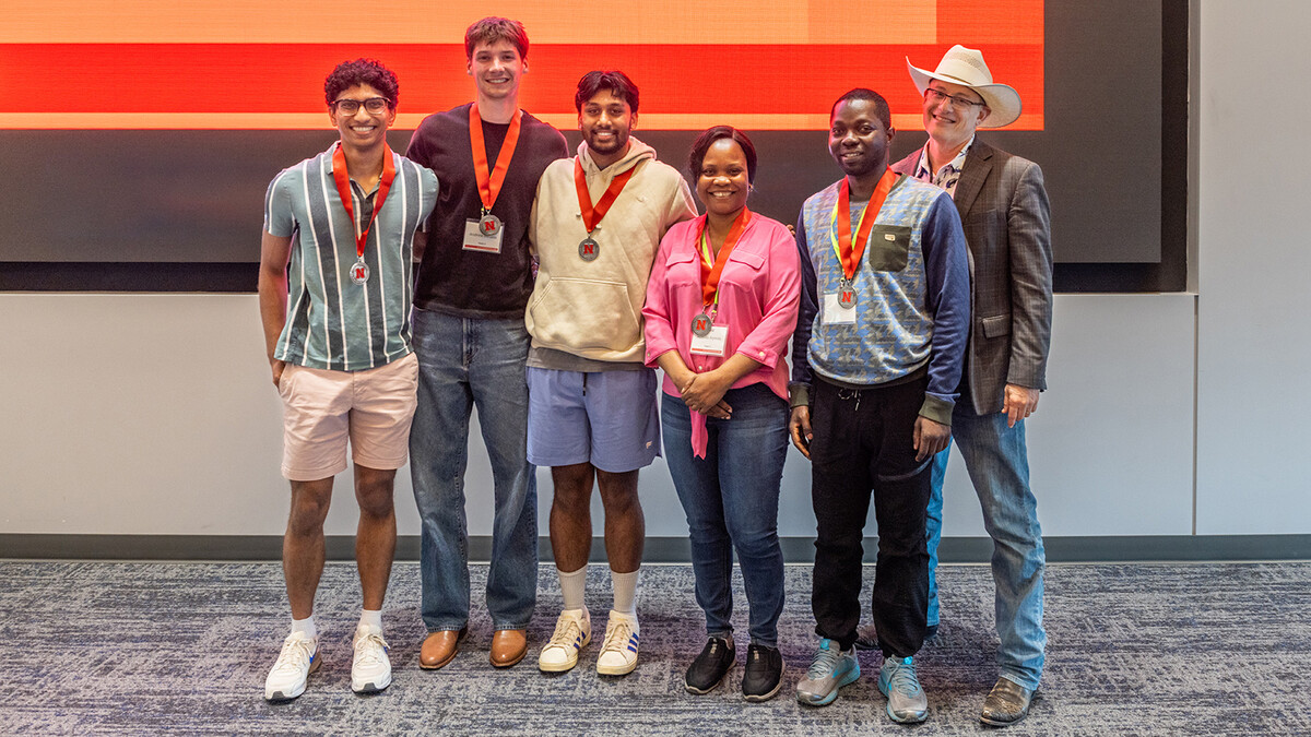 The winning team of Zohaib Shaikh, Andrew Medina, Deva Pushkaran, Abisola Aiyeola and Williams Boakye stand with TLTE Professor Guy Trainin. (Loren Rye | Pixel Lab)