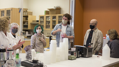 “Dracula: Mina’s Quest.” Right: (Left to right) Bethany Jackson, Zoe Kraus, Camille Lerner, Nathan Alexander, Jamie Bullins and Julie Reiling work on the perfect formula for the blood used in “Dracula: Mina’s Quest” at the Food Innovation Center. Photo by