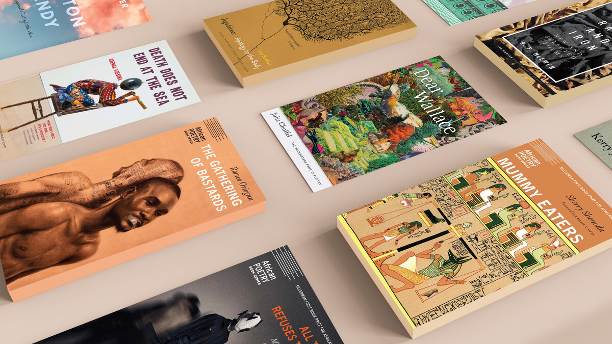 Book covers lined up on a surface.