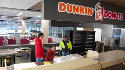 Workers continue the install of equipment in the Dunkin' Donuts café inside the Learning Commons at Love Library on Jan. 5. The Learning Commons and Dunkin' Donuts location are scheduled to open on Jan. 11.