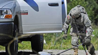 A vehicle is examined at a military checkpoint in this photo from the Department of Defense. The National Strategic Research Institute has earned a $1 million contract to continue its research on improving military checkpoints.