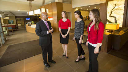 Dipra Jha, assistant professor of practice, in Hospitality, Restaurant and Tourism Management, meets with UNL students at the Hyatt Place in Lincoln's Haymarket.