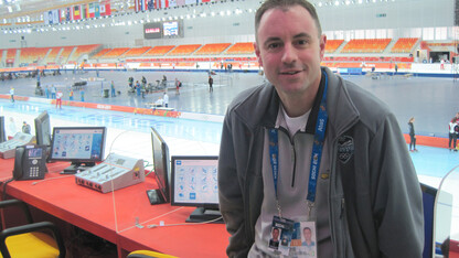 UNL alumnus Kevin Kugler sits in the Adler Arena Skating Center prior to announcing long track speed skating the 22nd Winter Olympics in Sochi, Russia. This is the fourth Olympic games Kugler has worked.