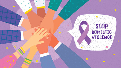 Hands in circle holding a purple ribbon, with the text, "Stop Domestic Violence."