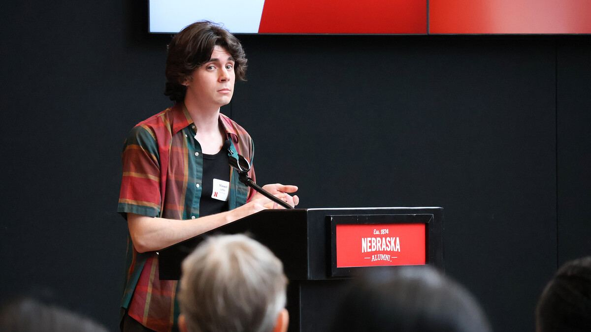Max Lottes, a psychology student, speaks on stage during the Student Research Days Slam at the University of Nebraska–Lincoln on April 9. He won the competition.