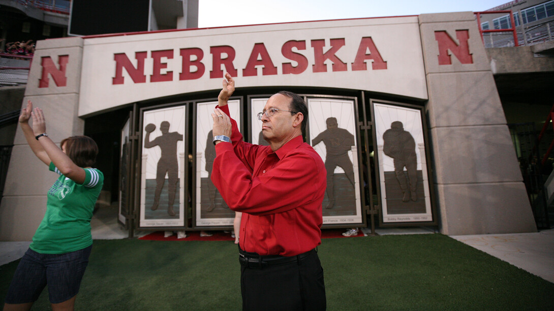 Juan Franco signals the start of the Big Red Welcome tunnel walk in Memorial Stadium.