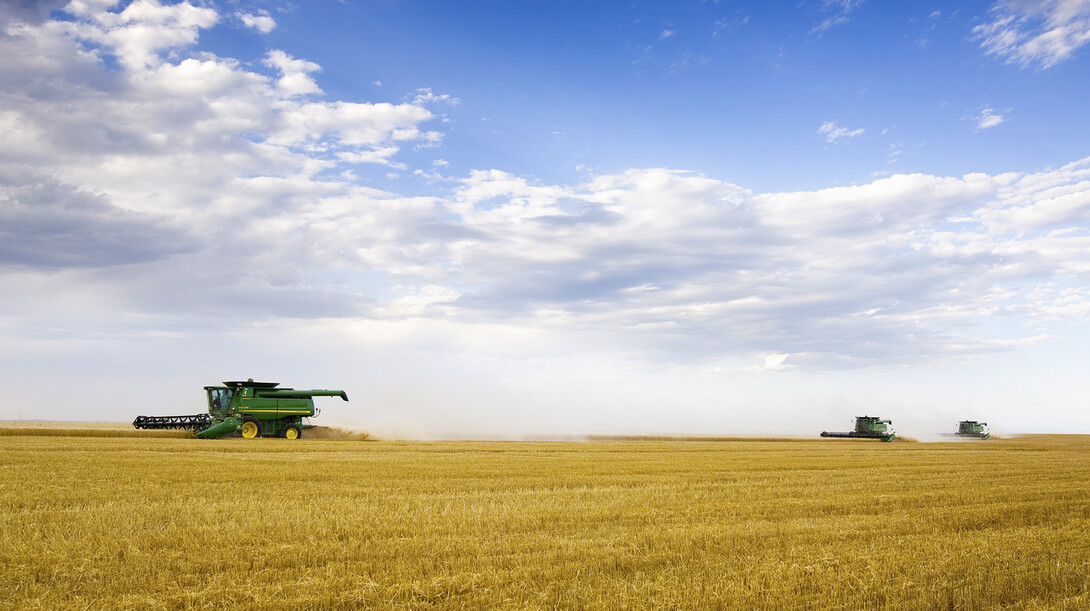 A custom combine crew harvests a wheat field west of Grant, Neb. UNL's School of Natural Resources is the home to a new Nebraska State Climate Office that will serve as the primary source of climate information for the Cornhusker State.