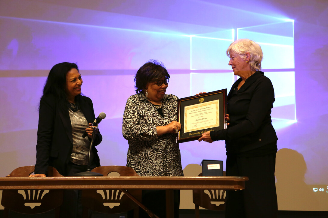 Dr. Melissa Farley is presented with the Prem Paul Award for Research in Anti-Human Trafficking by Anna Shavers and Sriyani Tidball. 