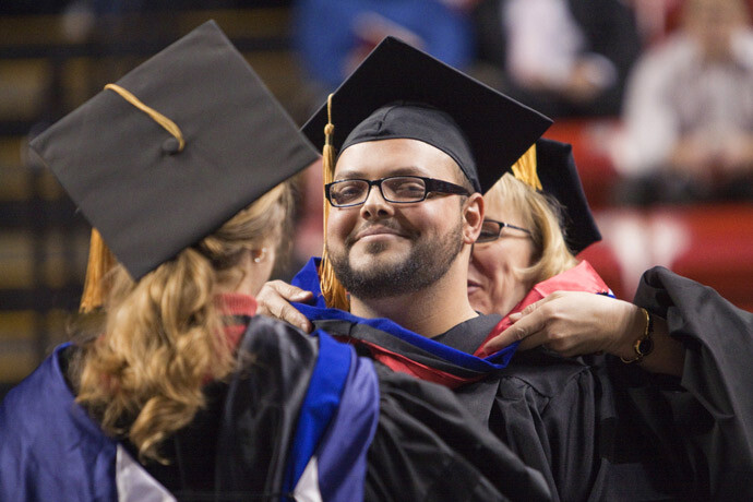 In this 2010 file photo, Andrew Bedrous receives his doctoral degree hood.