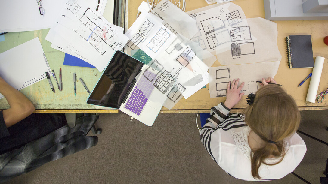 A student works on a design in an Architecture Hall classroom. Students in Architecture 310 designed concepts for Lincoln's Frank H. Woods Telephone Pioneer Museum, which is seeking a new home due to a real estate redevelopment project.