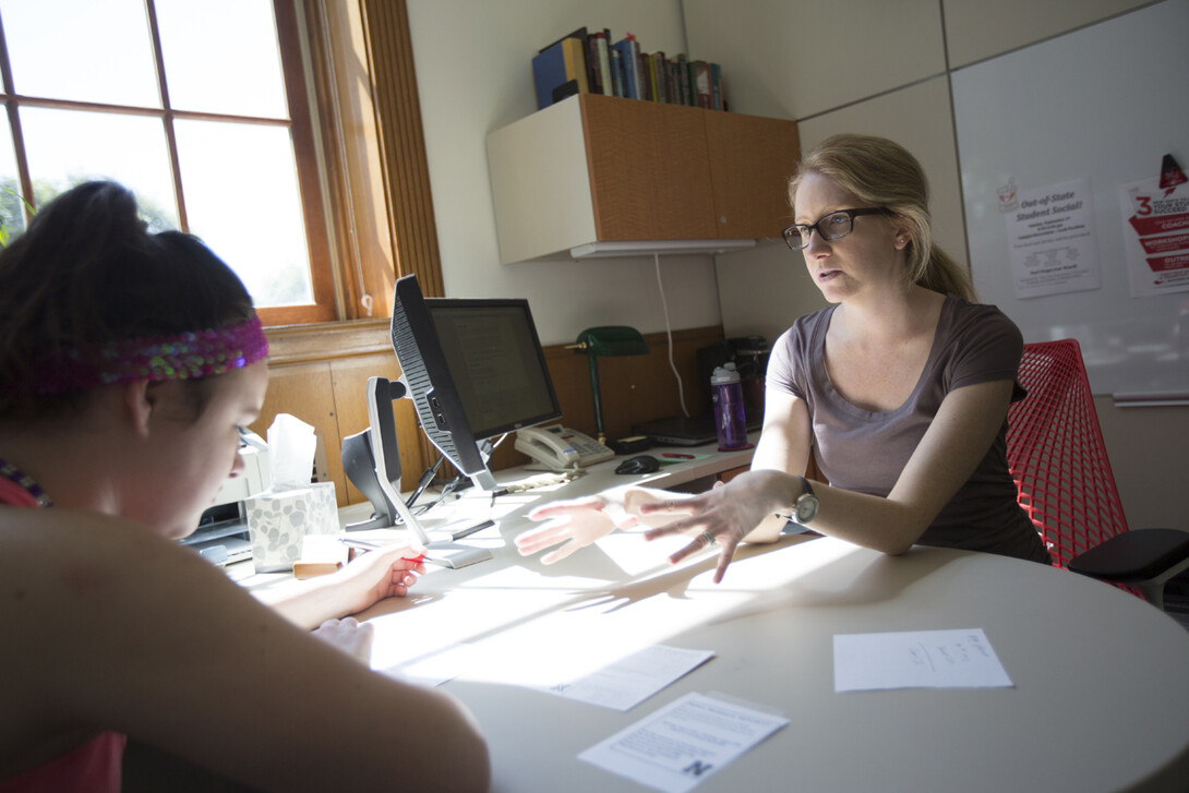 Kristin Plath (right), an adviser in the Exploratory and Pre-Professional Advising Center, meets with Natalie Mackley at the start of the fall 2013 semester. A new campus group, the Academic Advising Association, has been created to enhance student advising and expand collaboration between campus advisers.