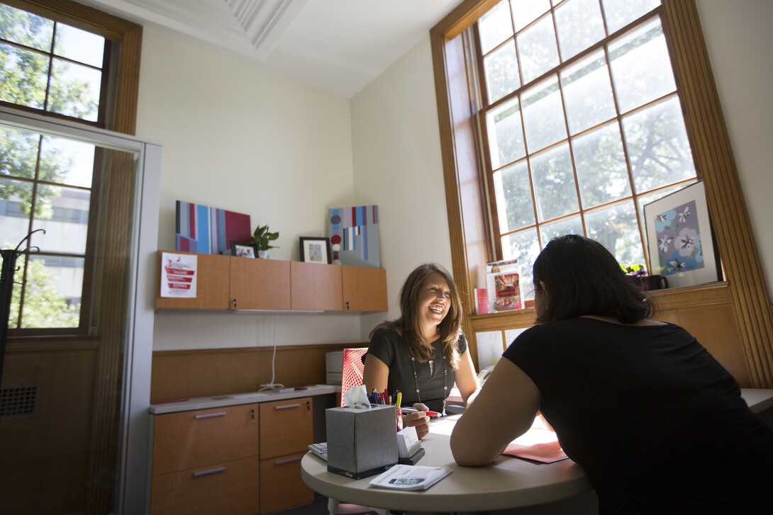 Katie Kerr, assistant director of UNL's Exploratory and Pre-Professional Advising Center, assists a student during an academic advising session at the start of the fall semester. More than 1,000 students on academic probation have participated in a new UNL program that helps chart a path toward academic success.
