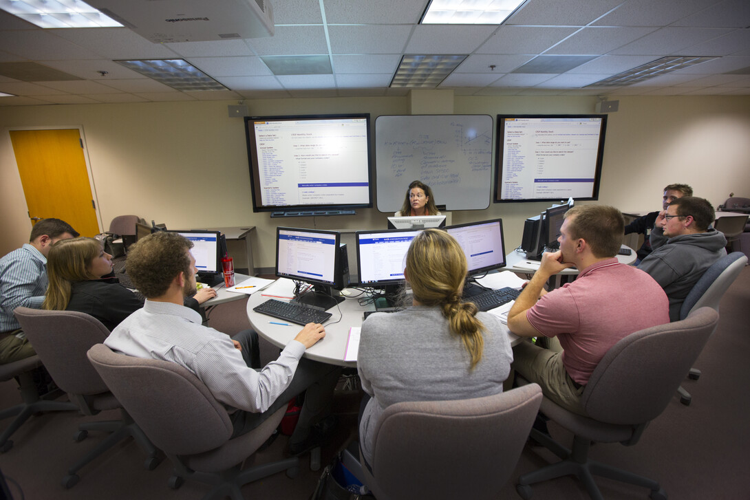 Donna Dudney, associate professor of finance in the College of Business, leads a finance course. The Board of Regents approved a name change for the college, dropping the name administration, on March 31.