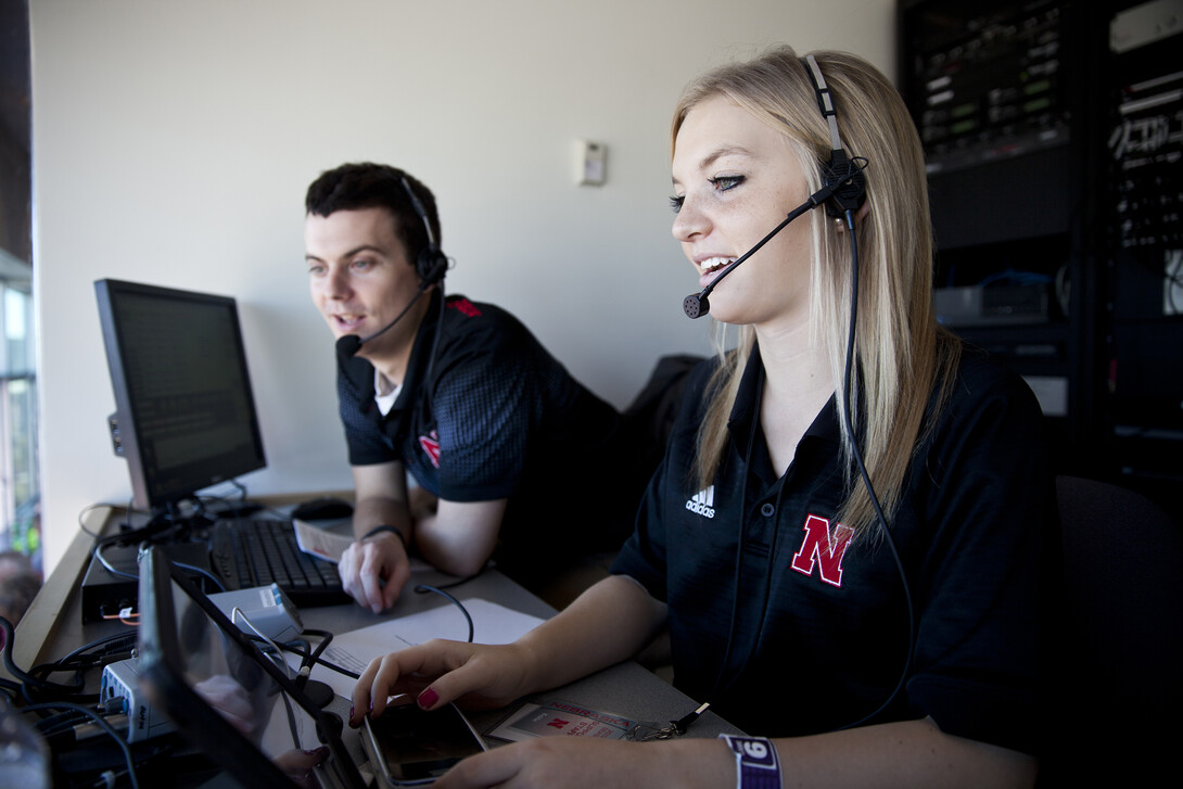 Broadcasting interns work in Memorial Stadium during a 2013 football game in Memorial Stadium. Journalism students will get the chance to call play-by-play action, work with HuskerVision, assist media and shoot photos on the sidelines during Nebraska's spring game on April 21.