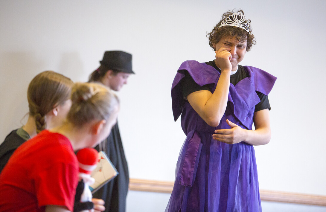 Princess Heladio Perez of Lincoln High School cries during a French drama based on Dr. Seuss. 