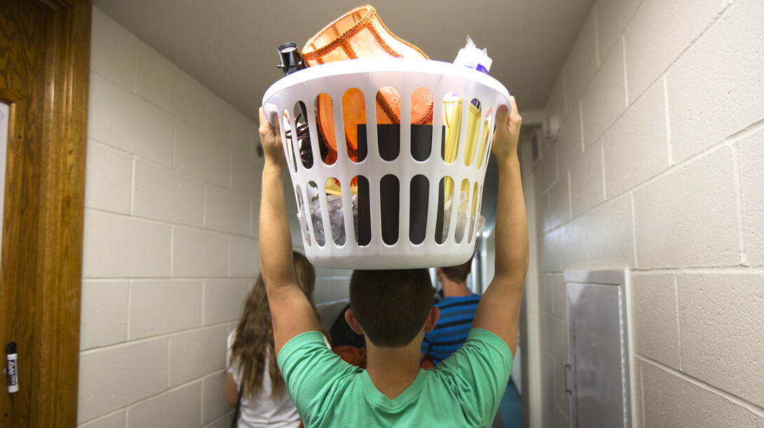 Kyle Beck of Gretna helps a friend move into Abel Residence Hall Thursday afternoon.