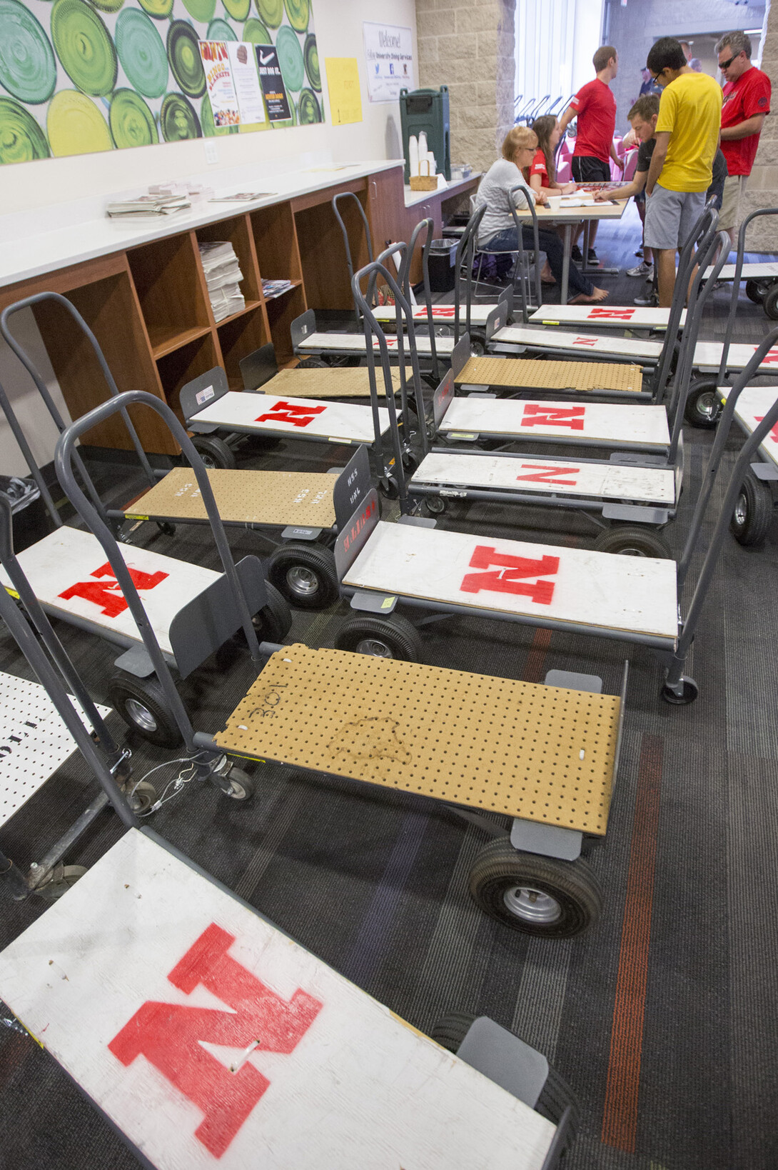 Carts sit at the check in desk in University Suites awaiting new residents.