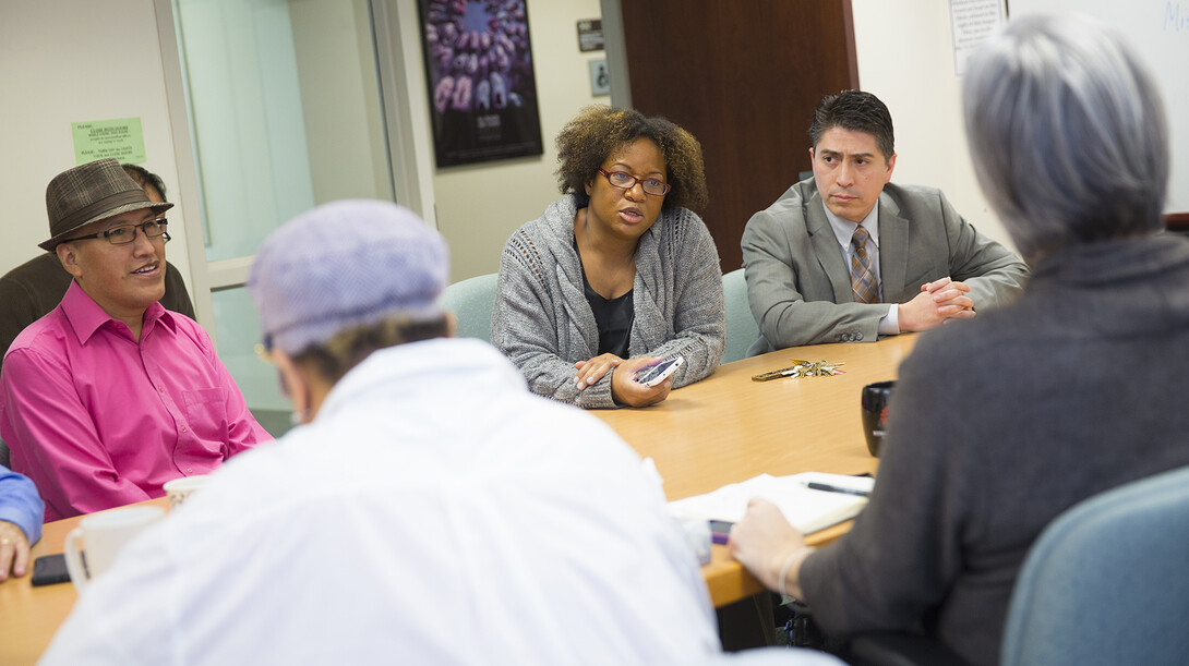 Ethnic studies faculty (from left) Waskar Ari, Jeannette Eileen Jones and Sergio Wals talk with Joseph Francisco, dean of Arts and Sciences, during an April 20 meeting. The group discussed a new UNL policy that will help ethnic studies attract and retain cutting-edge professors.