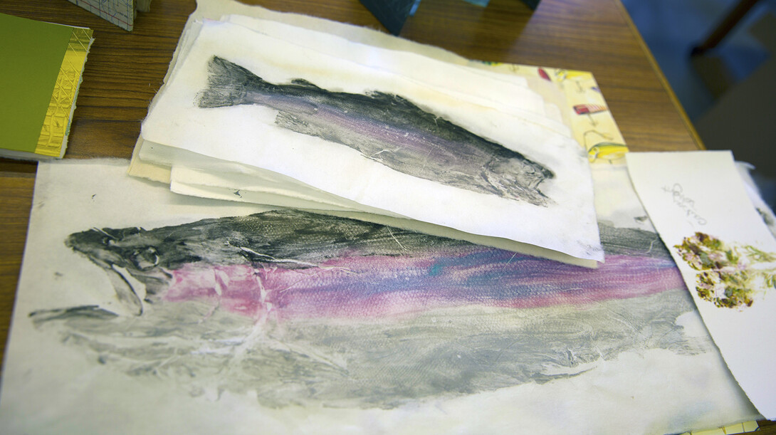 Prints of trout made by senior art student Ashley Bales. The prints led to Bales crafting a book on the lifecycle of a trout.