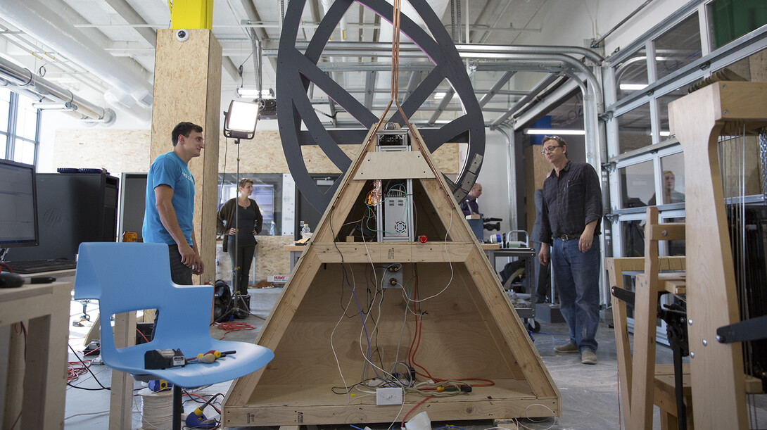 Members of the UNL Maker Club watch as their sculpture design rotates during an initial test in Nebraska Innovation Studio, a maker space based at Nebraska Innovation Campus.