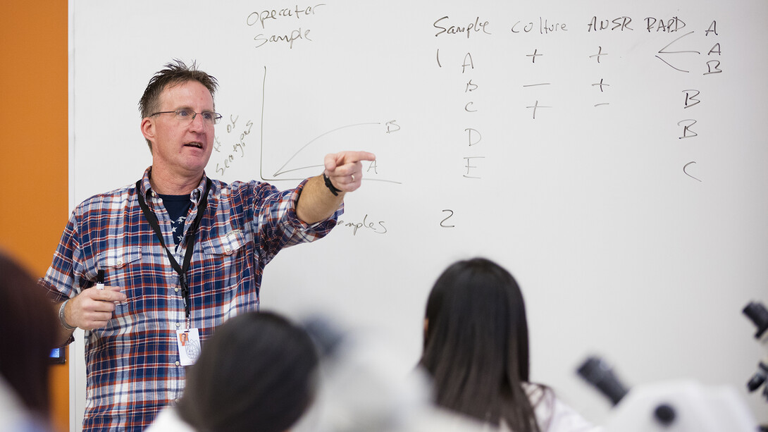 UNL microbiologist Andrew Benson leads a class discussion on gene sequencing of e.coli in December 2015. Benson will discuss his research during the spring Nebraska Lecture on April 20.