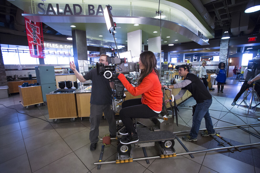 Nebraska's Amanda Christi runs a camera during an admissions video shoot in the Abel-Sandoz Dining Center.