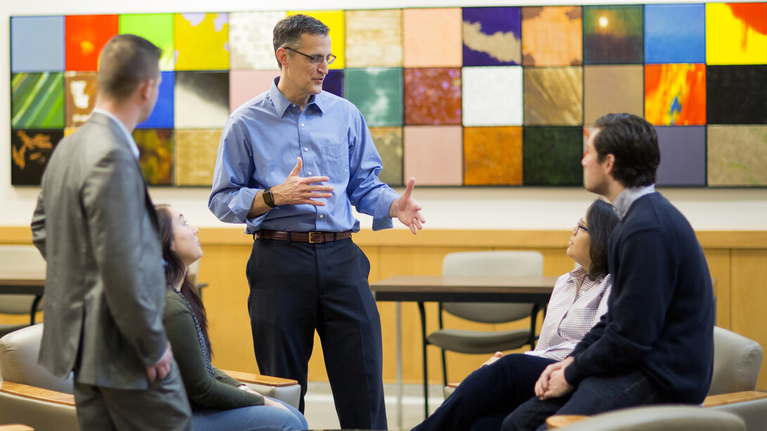 Richard Moberly, interim dean of the University of Nebraska's College of Law, talks with students in McCollum Hall. The college is partnering with other Nebraska universities to recruit incoming college freshmen from outstate Nebraska to pursue legal careers.