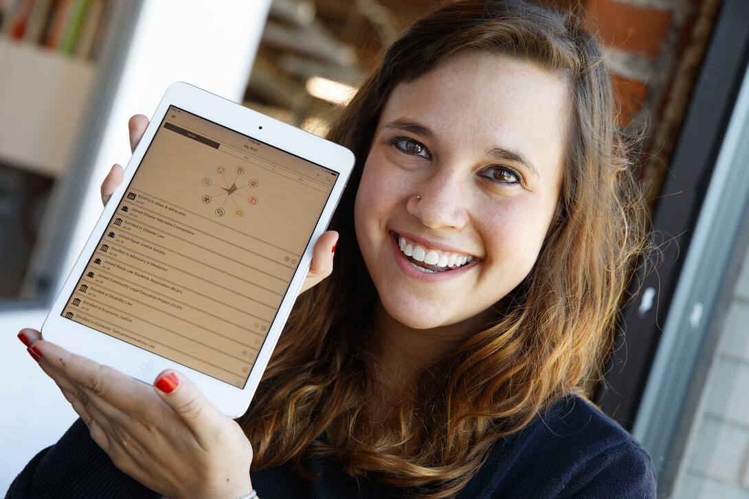 Second-year law student Megan Meyerson shows the Build Your Character app for College of Law students. College leaders say the app will give students a way to demonstrate skills to potential employers.