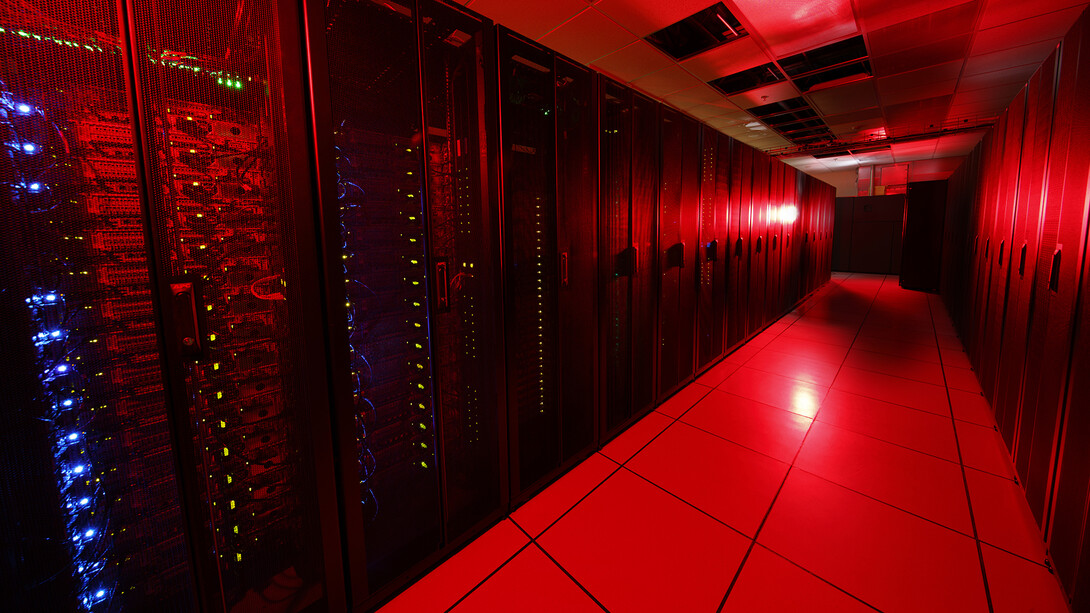 Servers in the Schorr Center, home to the Holland Computing Center, lit up to appear red.