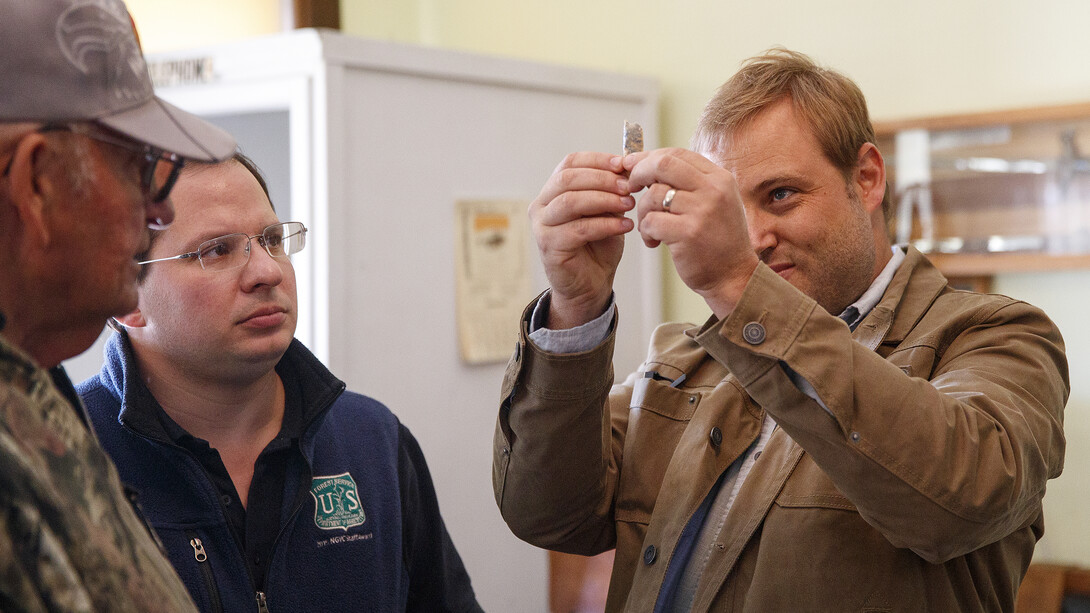 Matt Douglass (right) discusses an Eden point with Robert Coble (right) and Dennis Kuhnel during the Artifacts Roadshow on Oct. 7 in Mullen, Nebraska.