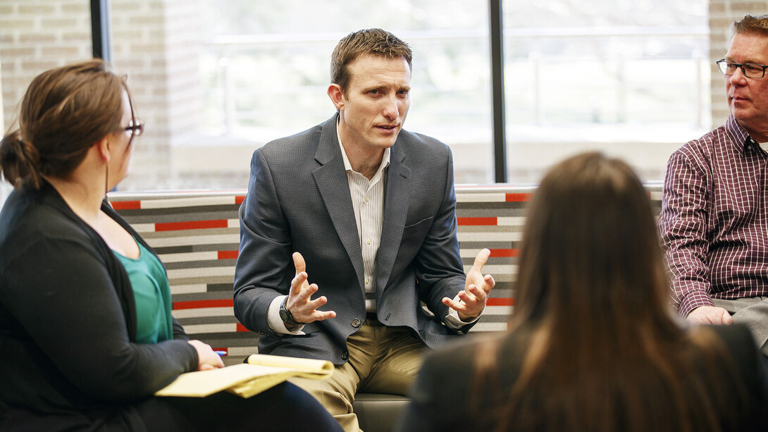 The pro bono work of faculty and students recently earned a national recognition for Nebraska Law. Ryan Sullivan (center), a professor of law, also collected an individual honor for his pro bono service.