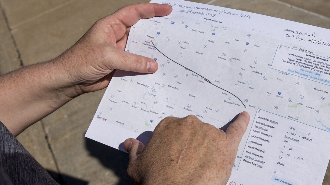 Kendra Sibbernsen outlines the predicted path of the June 24 balloon launch. The balloon traveled 163 miles, which was a record distance for the Nebraska program.