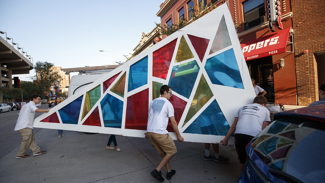 Architecture students install a temporary park in a downtown Lincoln parking space as part of a (PARK)ing Day event on Sept. 15.