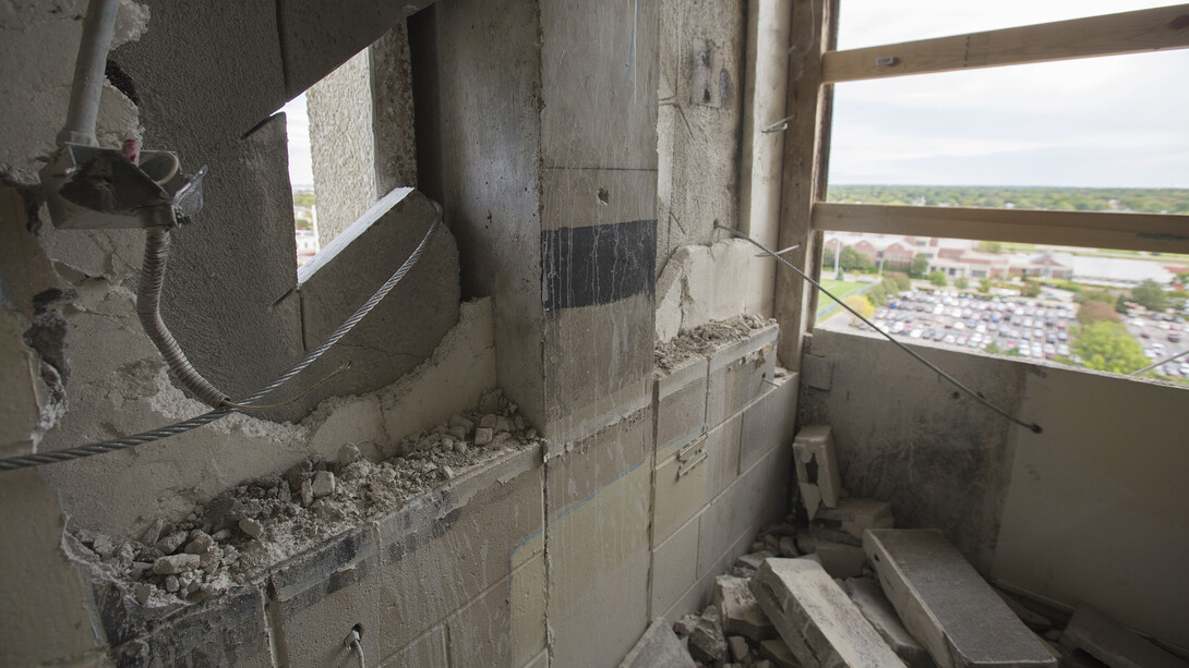 A cabling system is being used to link precast concrete panels on the outside of Cather and Pound halls. The cables are a safety precaution to keep the panels from falling away from the building and damaging other structures.