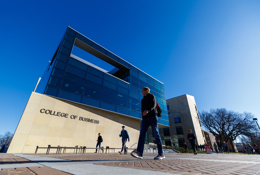 Student walking outside the College of Business 