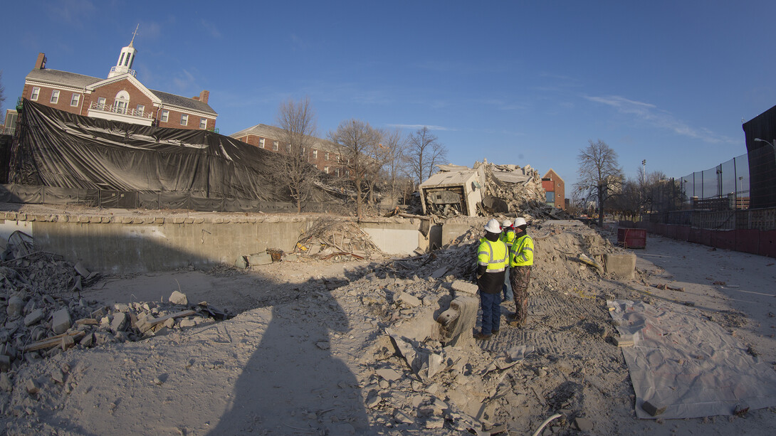 Nebraska's Grant Watson talks with a CDI representative next to the Cather-Pound site after the all-clear signal was given.