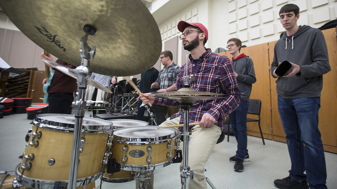 Jonah Payne, a freshman music major, plays in the engine room during Nebraska Steel practice. Payne is the first Husker to play in both Nebraska Steel and Pangea, a steel drum band organized through Lincoln Public Schools.