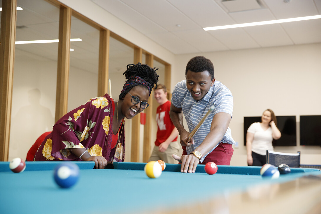 Students play a game of pool in the Massengale Residence Hall. CASNR photo shoot on East Campus. May 29, 2018