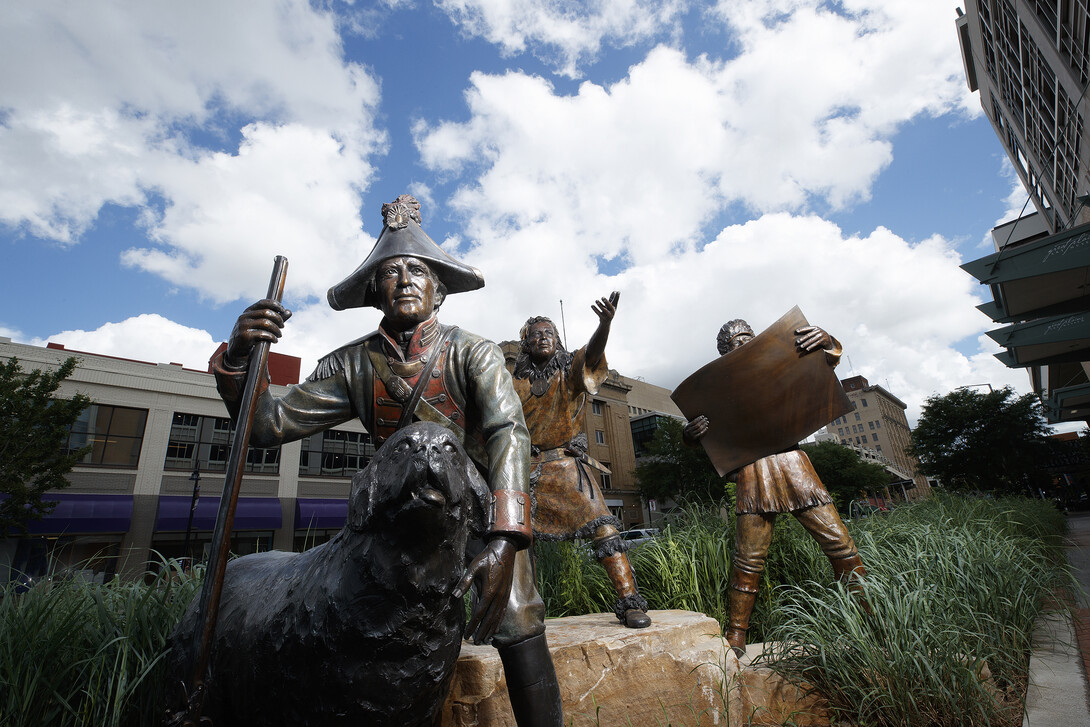 asses, this multi-figure bronze sculpture commemorates the journey of Lewis and Clark from 1804 to 1806. The co-captains point the way into the Great Plains Art Museum, encouraging passersby to step into the building and discover the history and art of Nebraska and the Great Plains.