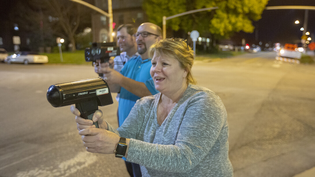 Members of the inaugural Citzens' Police Academy use radar speed guns during a course session on Oct. 17. The evening session included presentations on human resources, emergency management, police procedures and field sobriety tests.