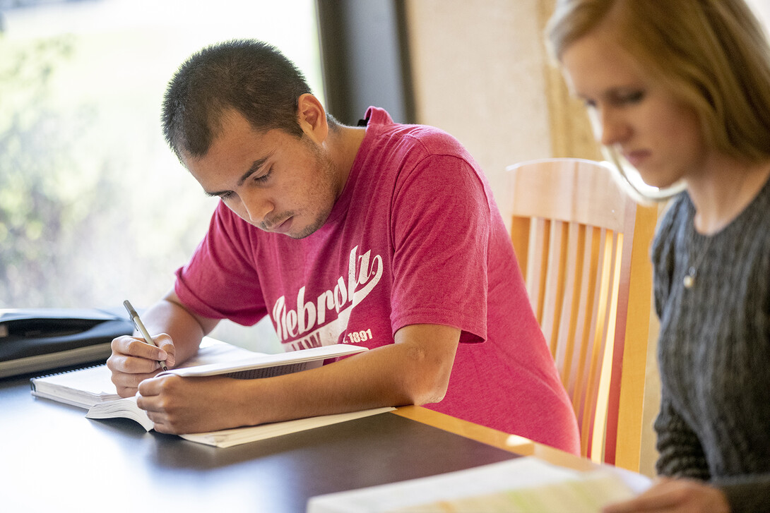 Mauricio Murga Rios studies with a fellow Nebraska Law student in 2018.