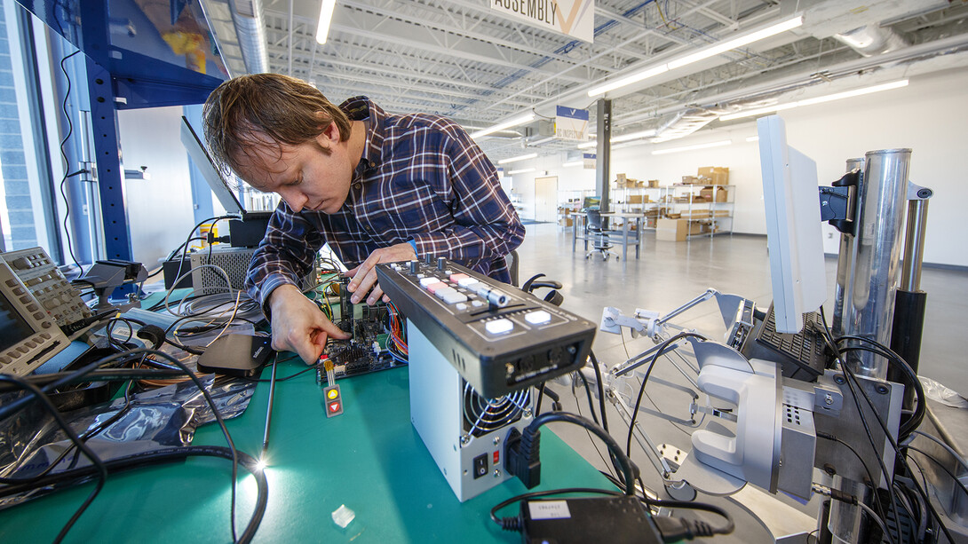 Jason Dumpert works with components in the console assembly area in the Virtual Incision lab at Nebraska Innovation Campus. Nebraska’s Shane Farritor, a professor of engineering and co-founder of Virtual Incision, was awarded six patents related to his surgical robot project.