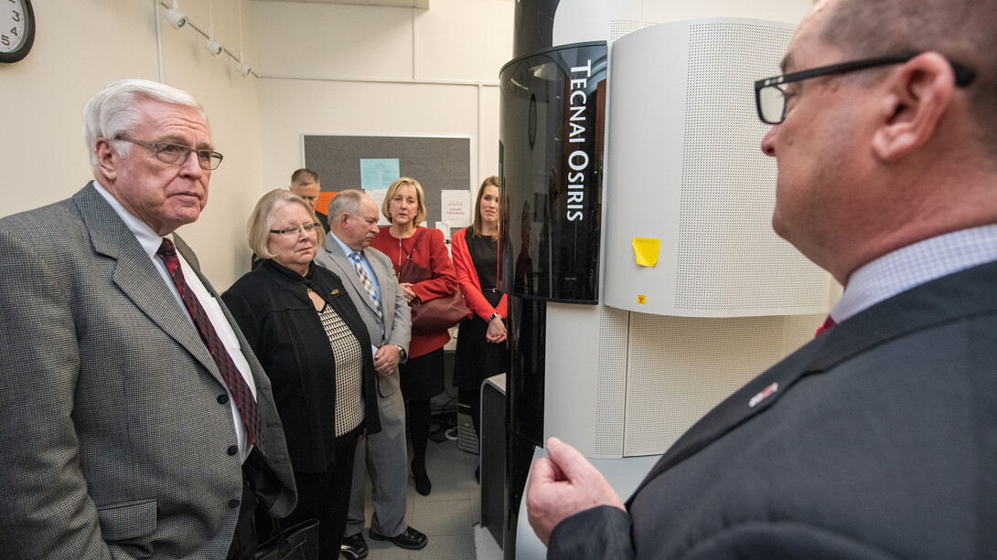 Nebraska's Bob Wilhelm (right) discusses nanoscience research facilities with the NU Board of Regents and university administrators during the Jan. 24 tour.