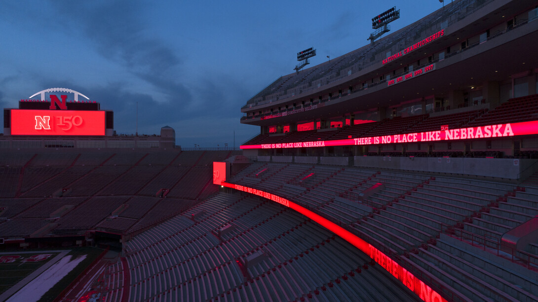 Ribbon boards and scoreboards light the night in Memorial Stadium.